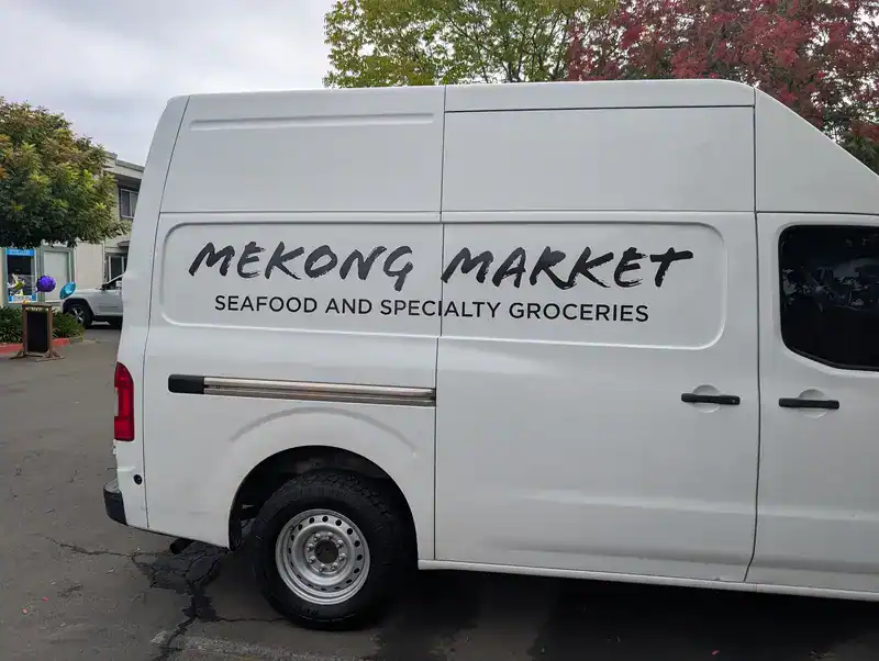 company service van with a graphics in the window